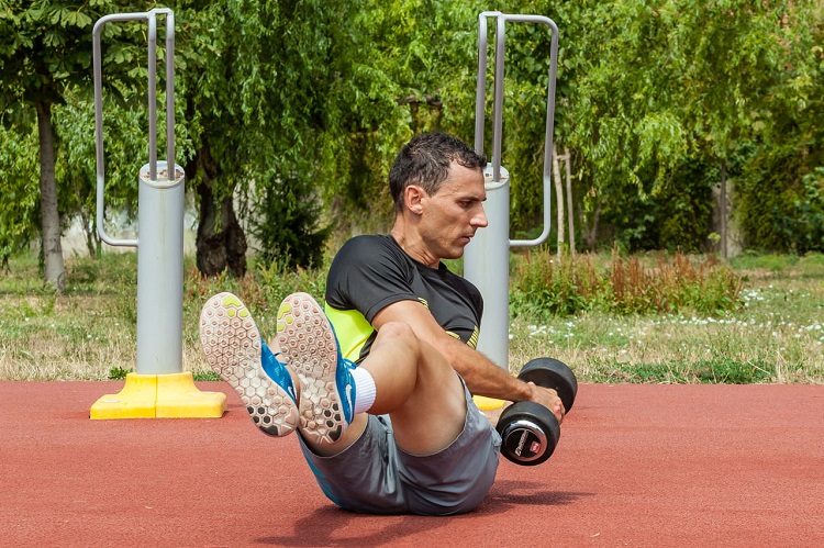 Russian twist with dumbbell